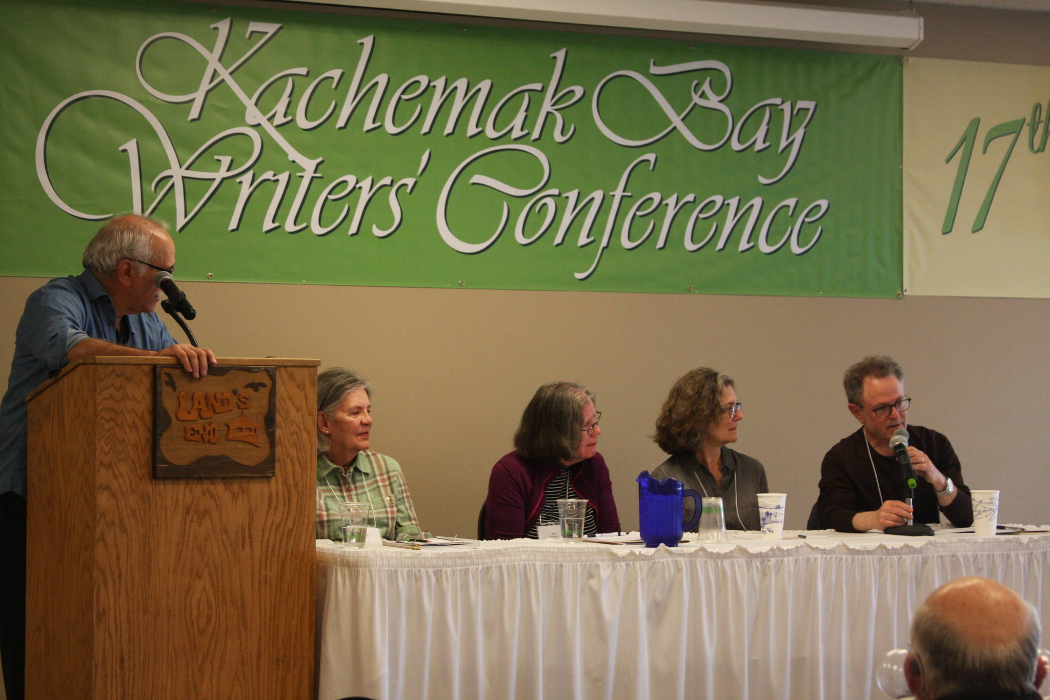 From left to right: Authors and conference presenters Richard Chiappone, Diane Glancy, Jean Anderson, Jean Hegland, and Floyd Skloot discuss how individuals create their own literary canon of admired authors during their panel, “Canon of One’s Own”, on Sunday, June 10, 2018 at the Kachemak Bay Writers’ Conference at Land’s End Resort in Homer, Alaska. (Photo by Delcenia Cosman)