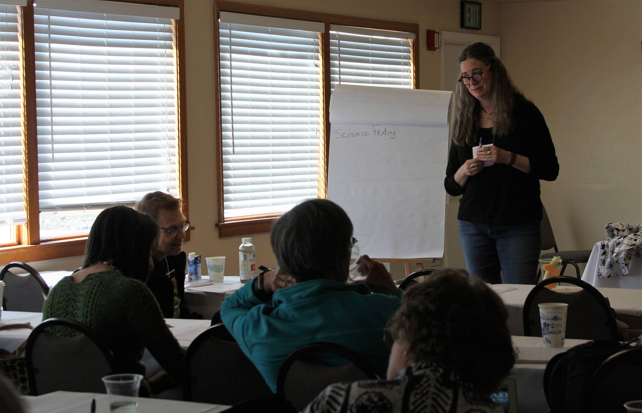 Resident poet Erin Coughlin Hollowell presents a unique seminar on science poems during her workshop, “Yoked: How Poems of Science Pull Twice the Load”, on Sunday, June 10, 2018 at the Kachemak Bay Writers’ Conference at Land’s End Resort in Homer, Alaska. (Photo by Delcenia Cosman)