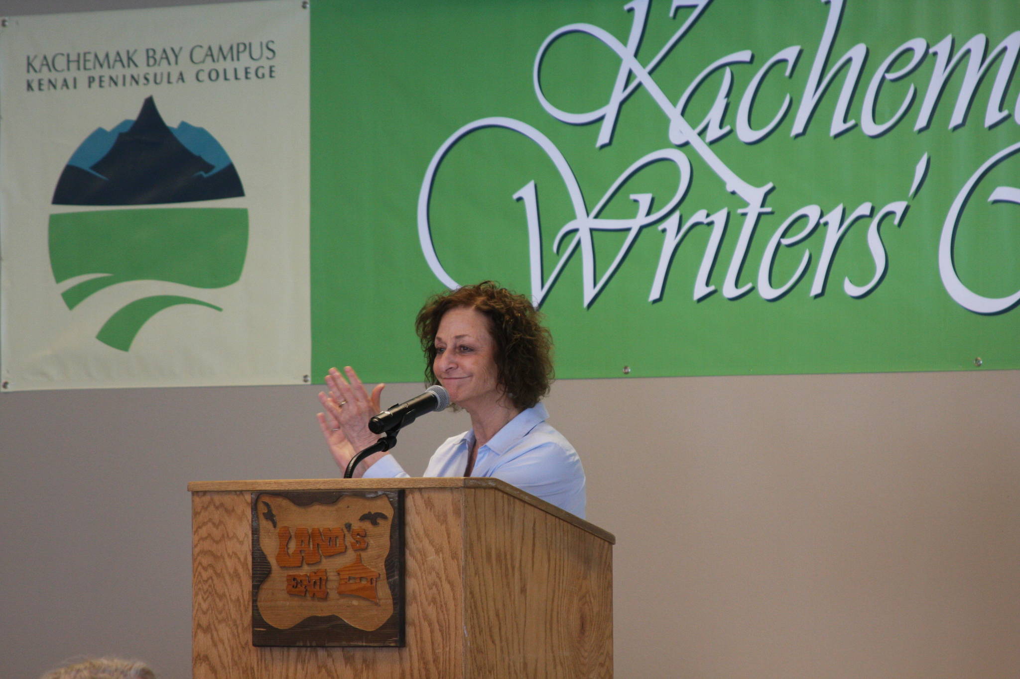 Kachemak Bay Campus Director Carol Swartz gives a final farewell to all of the faculty and attendees of the 2018 Kachemak Bay Writers’ Conference during the closing ceremony on Tuesday, June 12, 2018 at Lands’ End Resort in Homer, Alaska. (Photo by Delcenia Cosman)