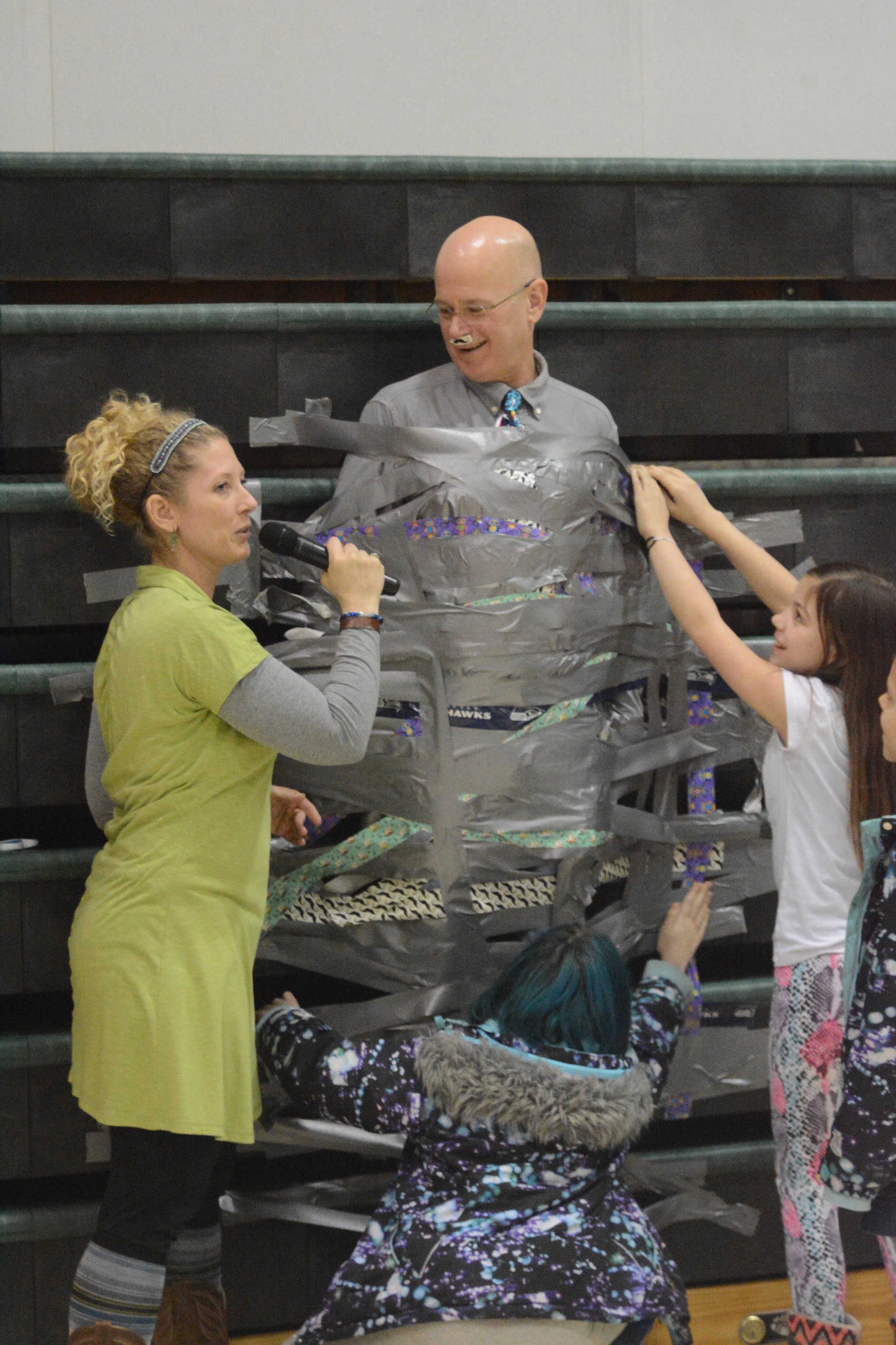 Students duct tape principals to wall