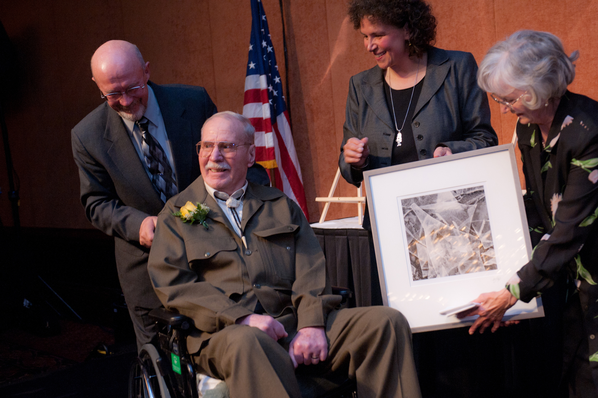 Jim Rearden, center, wearing his Alaska tuxedo, receives the 2011 Governor’s Award for the Humanities from Commissioner of Commerce & Economic Development Susan Bell as his wife, Audrey, far right, and son, Mike Rearden, watch. Homer writer Jim Rearden, center, smiles at the crowd following the presentation of his humanities award at the Alaska State Council on the Arts Governor’s Awards Banquet Oct. 19. With Rearden are, from left, his son Mike, Commissioner of Commerce & Economic Development Susan Bell and wife, Audrey Rearden.