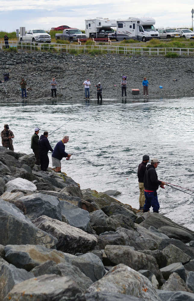 Fishermen fish during the incoming tide on Sunday at the Nick Dudiak Fishing Lagoon on the Homer Spit.