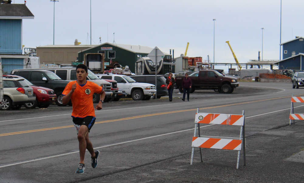 Pedro Ochoa runs towards the finish line, full minutes ahead of other competitors, at the Spit Run on Saturday, June 25.