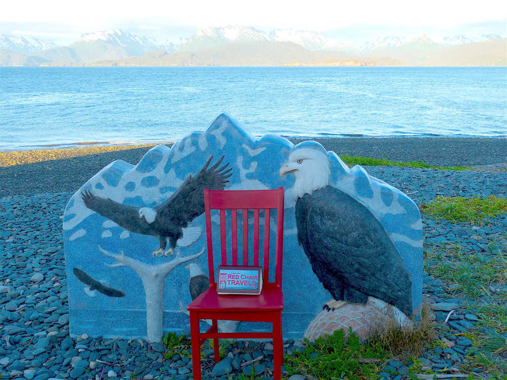 The Red Chair rests on the Homer Spit beach by the Jean Keene memorial at Land's End Resort.