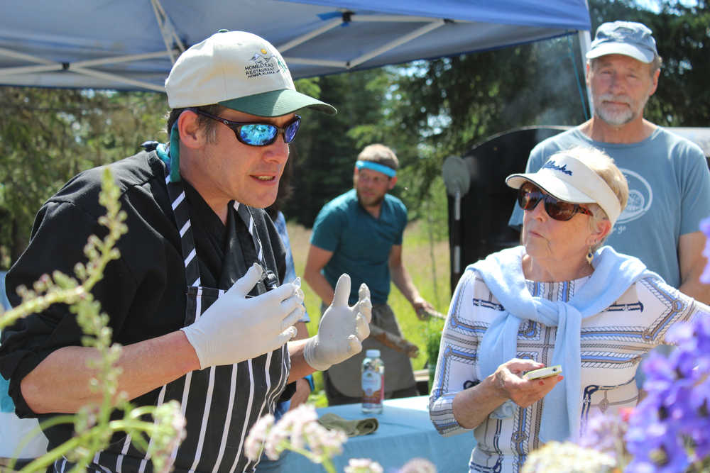 Richard Nell explains the process of making pickled ginger at home to a group at Synergy Gardens' First Annual Great Garlic Scape Festival.
