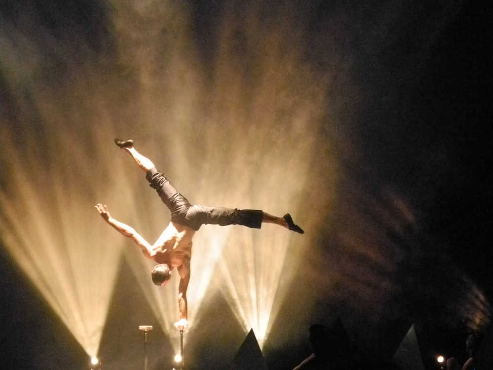 Andrey Moraru balances on one hand during Quixotic's performance in November 2012 at the Homer Mariner Theatre.