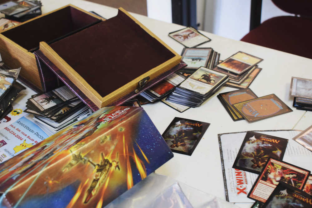 Magic: The Gathering cards scattered on one of the business's many playing tables.