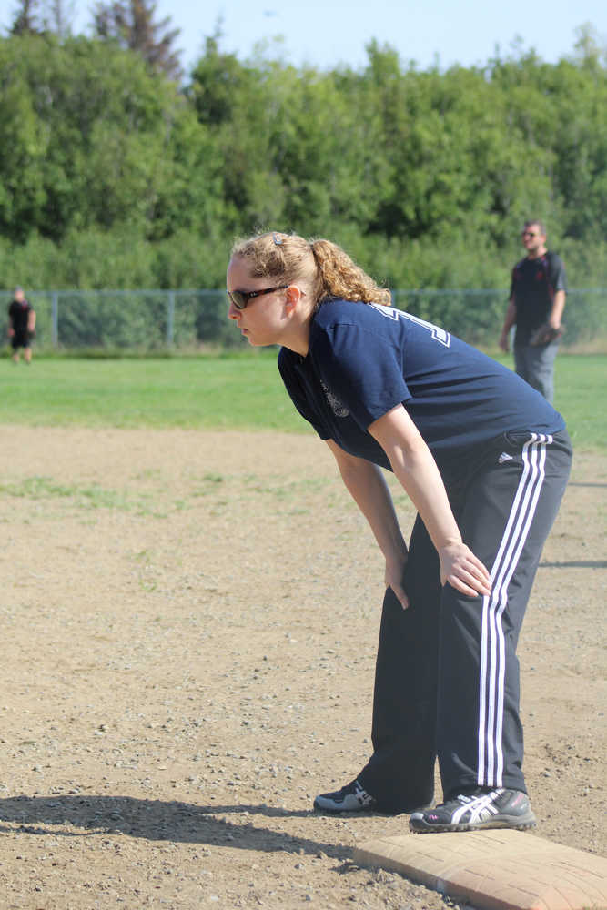 Casey Moss of Beluga Lake Lodge team waits on first for her teammate to hit the ball so she can advance to second during the first championship game of the Homer city league tournament on Sunday, July 31 at Jack Gist Park.