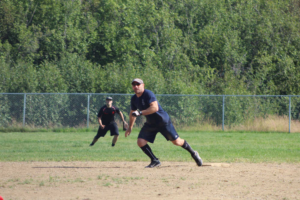 Beluga Lake Lodge player Chris Perk takes off from second base during the first championship game against Mean Machine for the Homer city league tournament championship on Sunday, July 31.