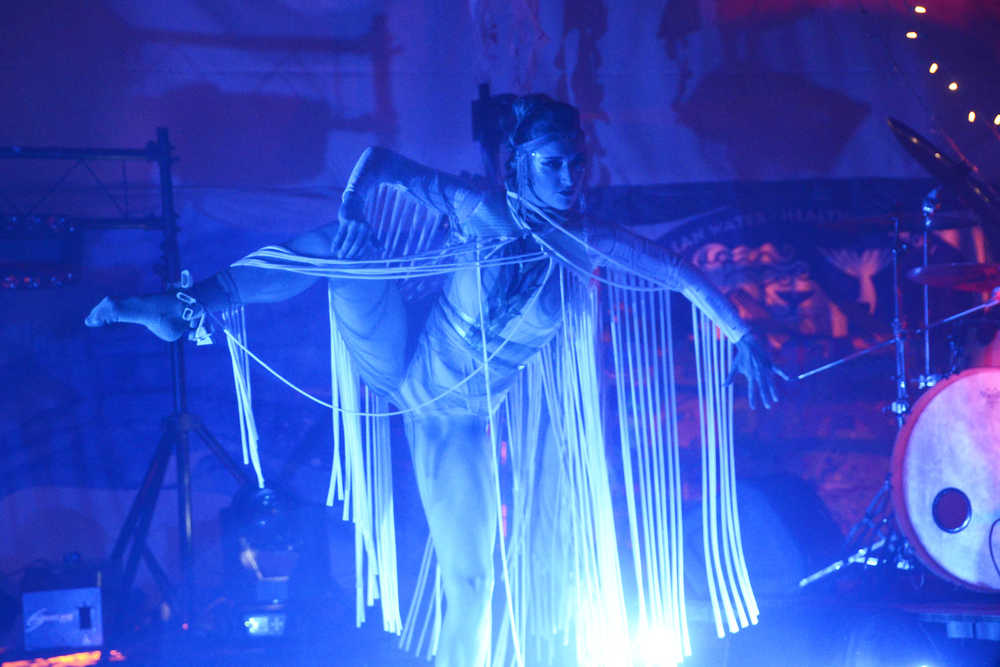 Photo by Megan Pacer/Peninsula Clarion A ballet dancer perfoms with Quixotic on Sunday, Aug. 7, 2016 at Salmonfest in Ninilchik, Alaska. Quixotic is a cirque nouveau that blends live music with dance, lights and other performance art.