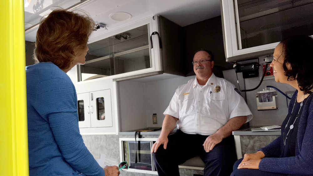 Homer Fire Chief Bob Painter talks with Sen. Lisa Murkowski, left, and USDA-Rural Development Under Secretary Lisa Mensah on Monday inside a new ambulance for the city made possible through a combination of funding from USDA, the State of Alaska and the City of Homer.