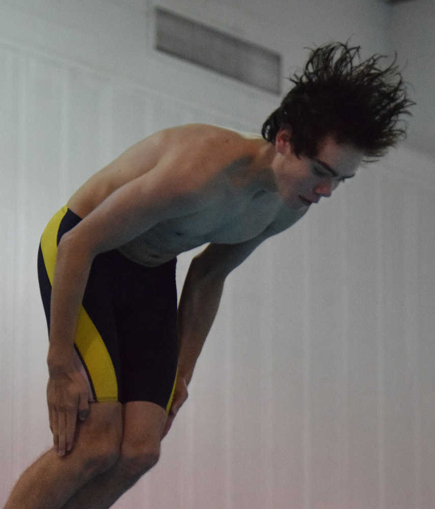 Spencer Warren of Homer eyes the water as he performs a dive Friday at the Kenai Invite at Kenai Central High School.