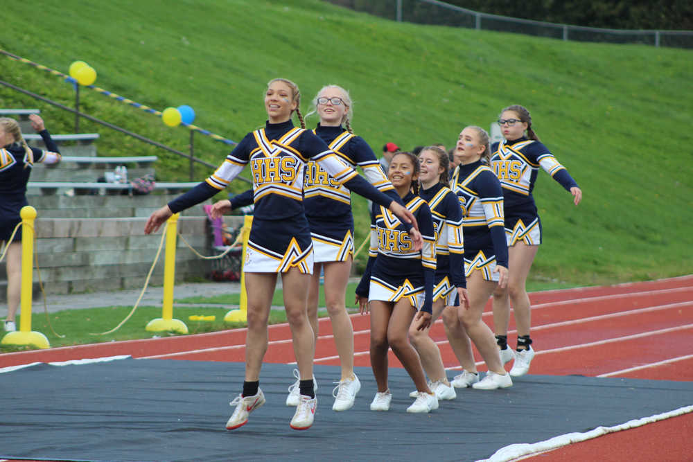 Homer High School's cheerleaders count out 50 jumping jacks in celebration of the Mariner's 50 points during the homecoming football game against Redington on Saturday, Sept. 24.