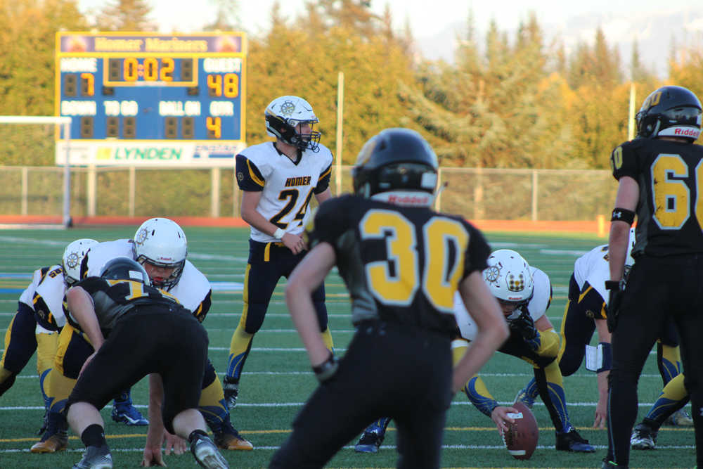 Sean Love gets ready to receive the ball at the edge of the Mariners' end zone with two seconds left on the clock in Homer's game against Voznesenka on Friday, Sept. 30. Homer High's team was the guest team, and beat Voznesenka 48-7.
