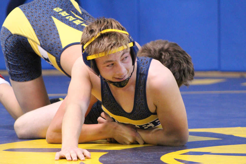 Cole Bernier works to release himself from his wrestling partner's hold during a Mariner wrestling practice.