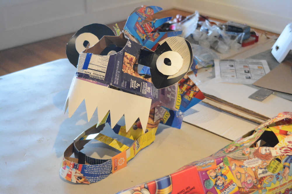 Some of the recycled box masks made by Claudio Orso-Giacone in a workshop at Bunnell Street Arts Center last month.