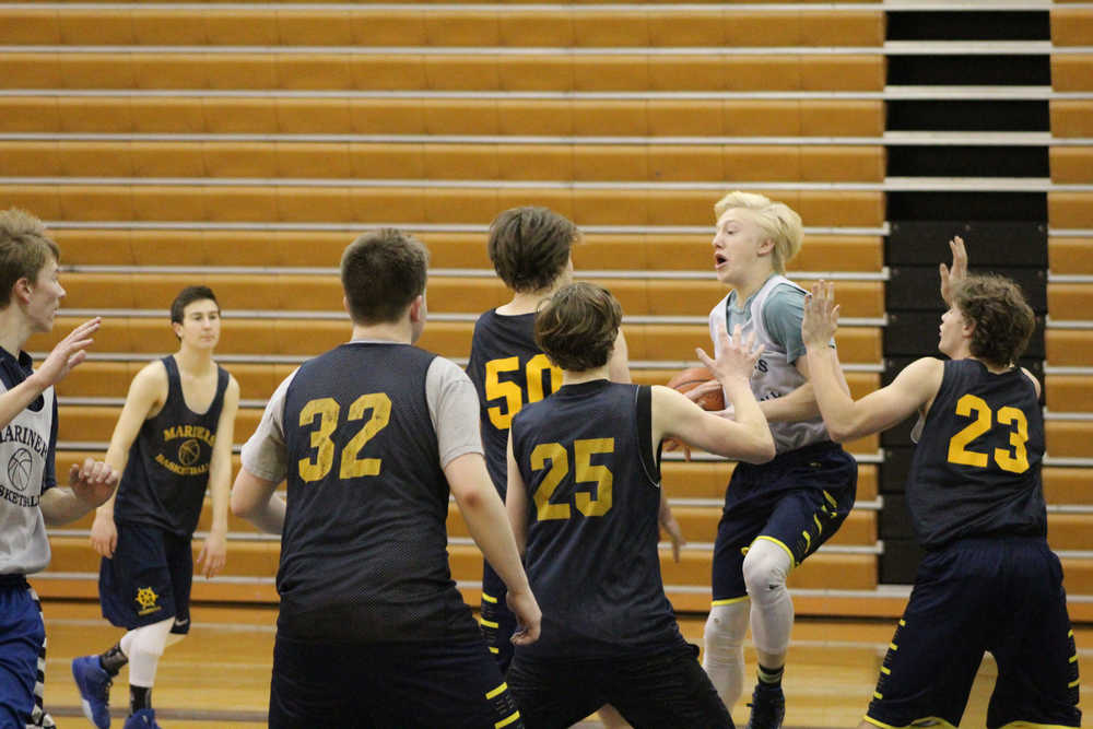 Charles Rohr jumps as he starts to the pass the ball to a teammate during a practice on Dec. 9.