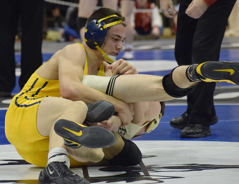 Photo by Joey Klecka/Peninsula Clarion Homer senior Timmy Woo battles with Glennallen's Caden Gerlach in the 160-pound final of the Class 1-2-3A state wrestling championships Saturday night at the Alaska Airlines Center in Anchorage.