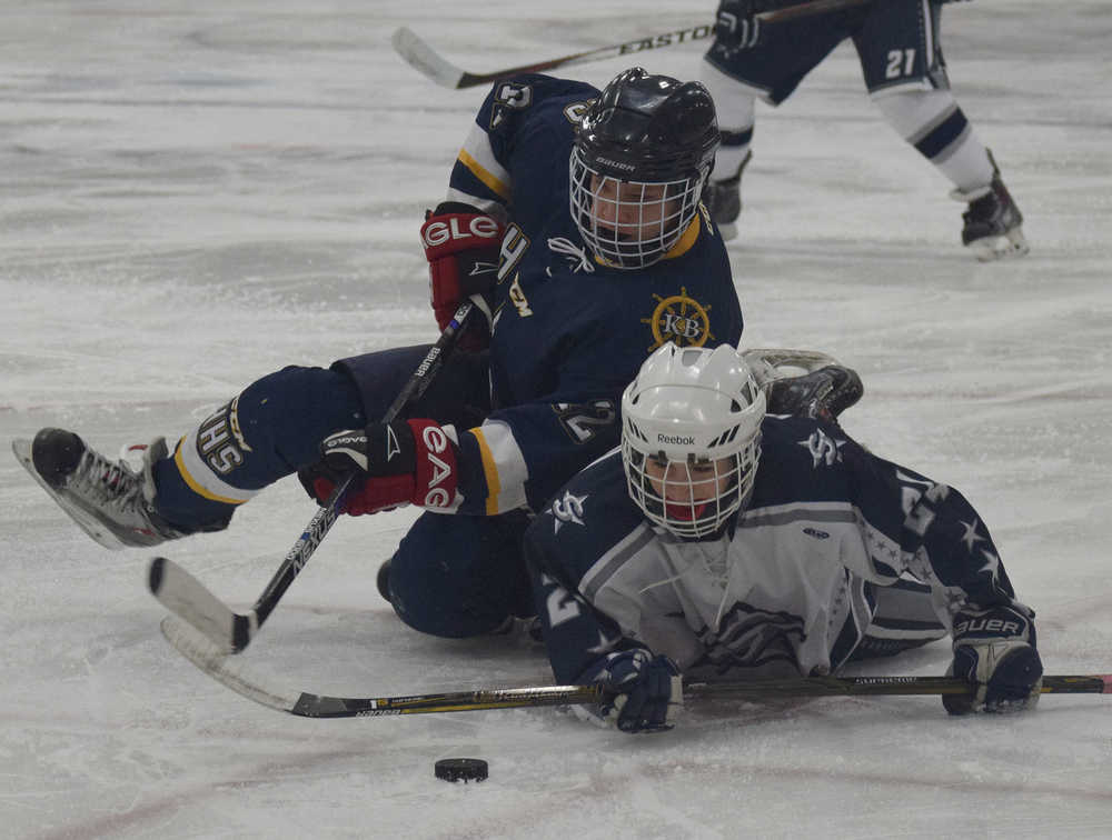 Photo by Joey Klecka/Peninsula Clarion Soldotna's Journey Miller (bottom) and Homer's Dimitry Kuzmin collide after a faceoff Thursday evening at the Soldotna Regional Sports Complex.