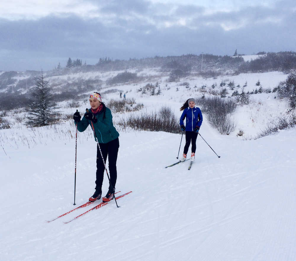 (left to right) Autumn Daigle and Katie Davis ski on a trail at Lookout Mountain for the Ski Your Age event on Monday, Dec. 26.