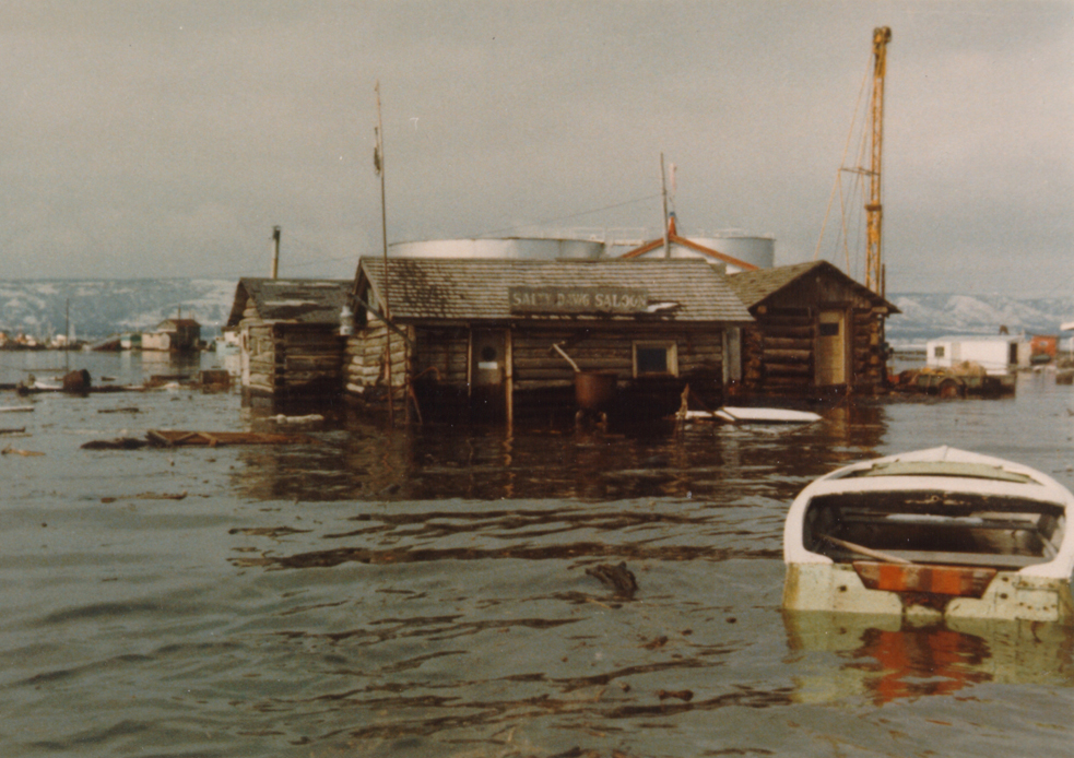 Left, big tides flooded the Salty Dawg on the Spit after the quake.-Photo provided, Pratt Museum