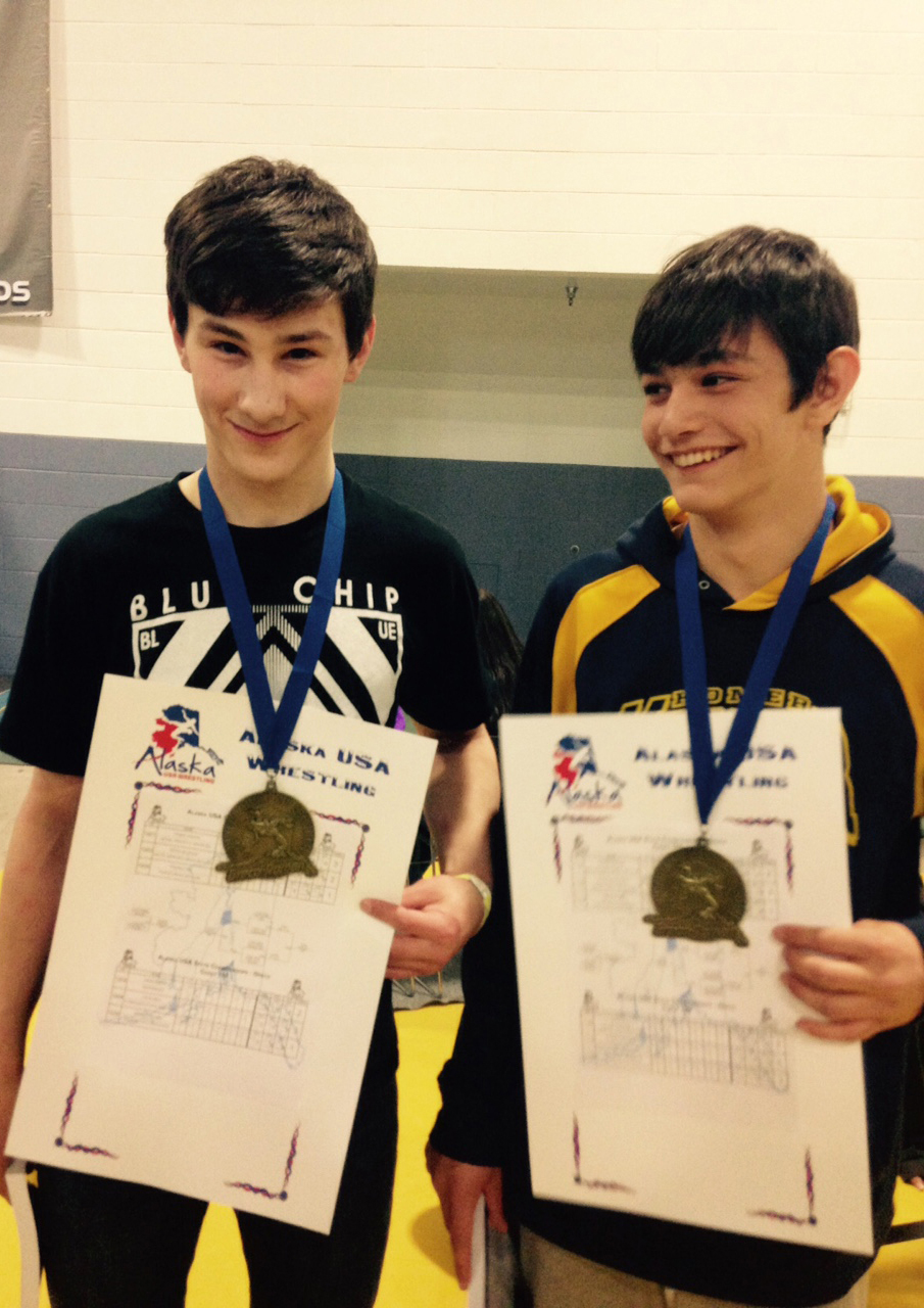 Triple crown champions and Popeye wrestlers Tristen Cook and Timmy Woo each placed first in three events at the Alaska State Wrestling Championships: folkstyle, freestyle and greco. -Photo provided
