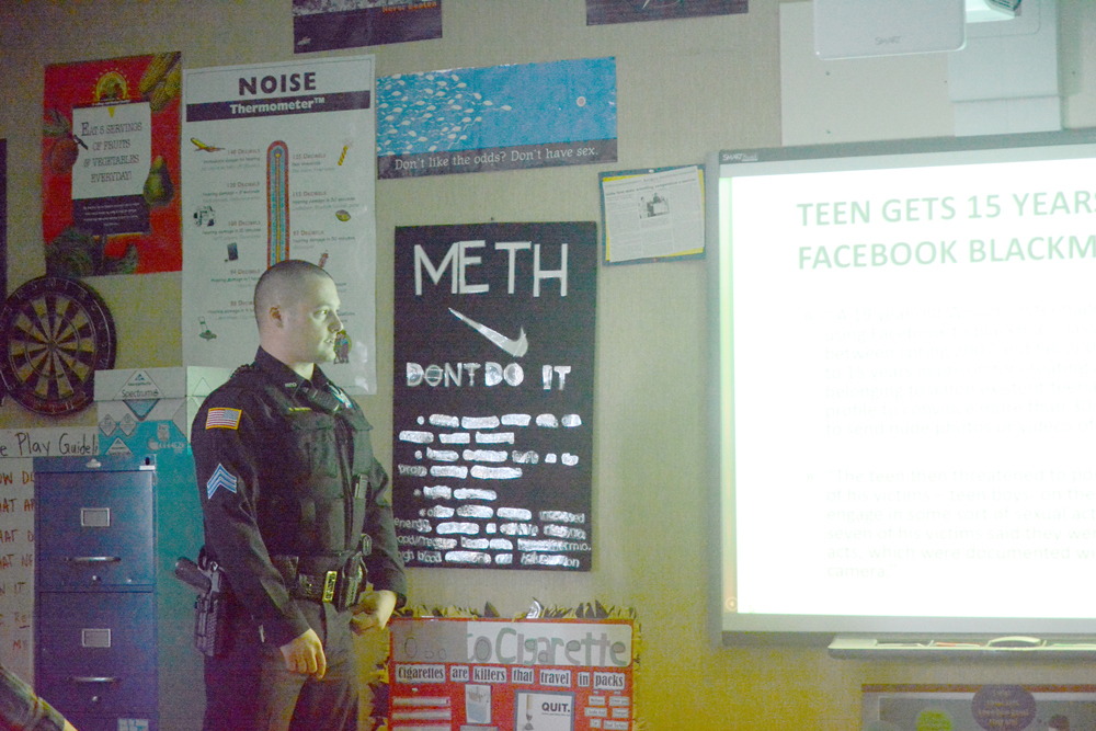 Homer Police Sgt. Ryan Browning talks about digital consciousness last month for Chris Perk’s 9th grade health and physical education class at Homer High School.