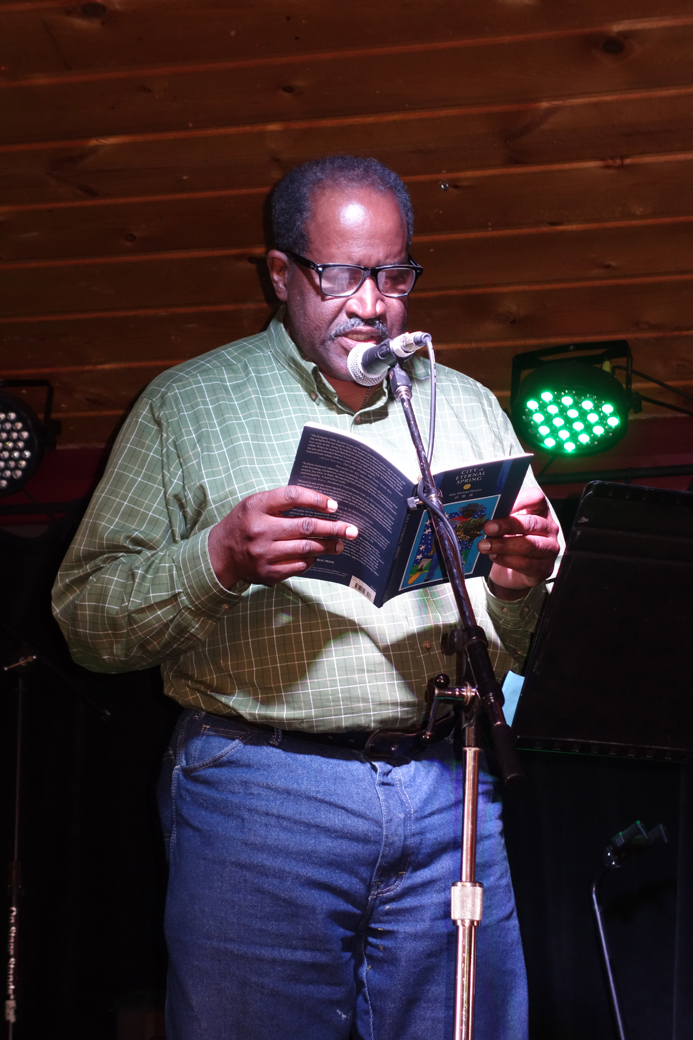 Poet Afaa Michael Weaver reads from his work Sunday at Alice’s Champagne Palce.-Photo by Shana Loshbaugh