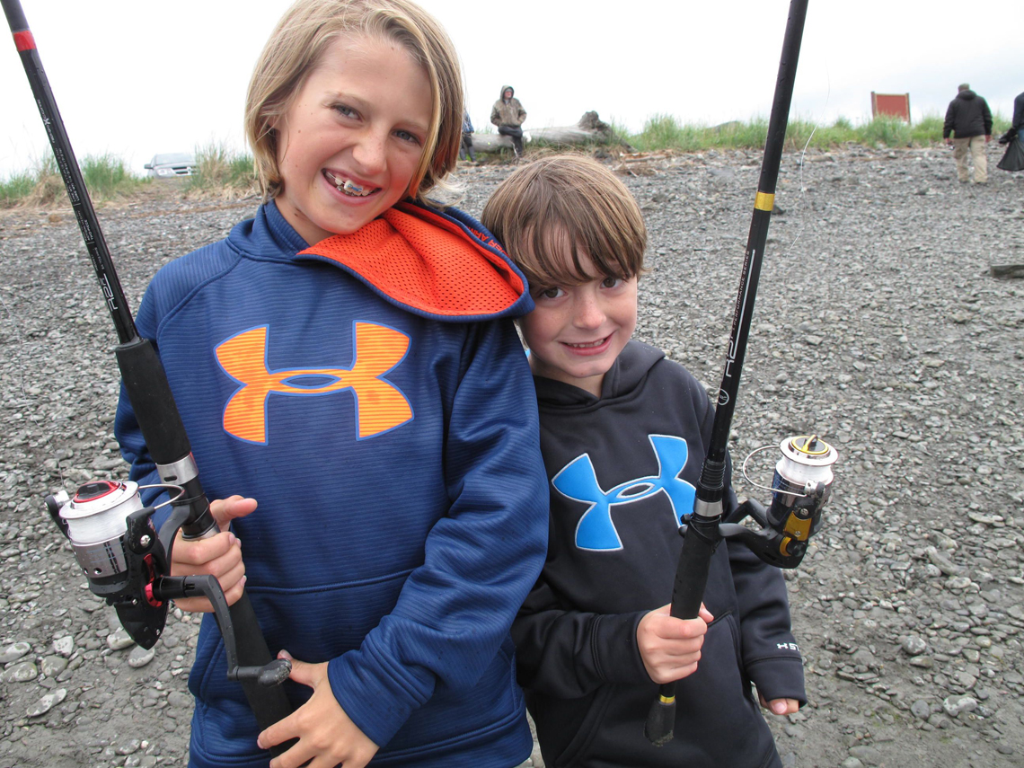 Mason and Tanner Knight from San Diego, Calif., pose after trying their luck at the Nick Dudiak Fishing Lagoon. Their dad Mike says, “The Fishing Hole makes fishing with kids possible.” The next Youth-Only Fishing Day at the Hole is scheduled for Aug. 1.-Photo by Miranda Weiss