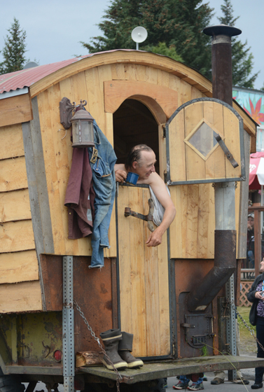 Otto Kilcher takes a bath in the Kilcher family’s “Alaska: the Last Frontier” float.-Photo by Michael Armstrong