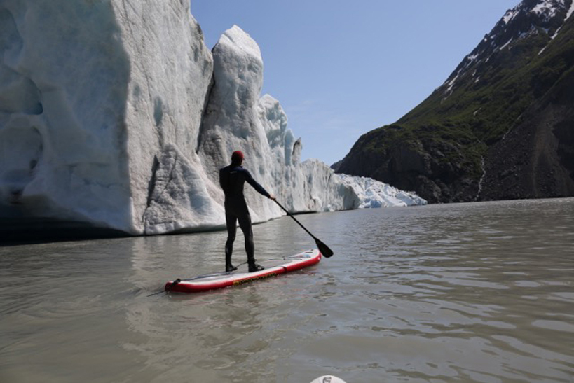 Pete Alexson gets a closeup view of Grewingk Glacier Lake during a standup paddleboard tour.-Photo provided