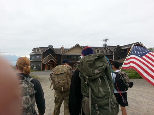 Members of the Alaskan Warrior Class Community do a 6-mile ruck march on East End Road in June.