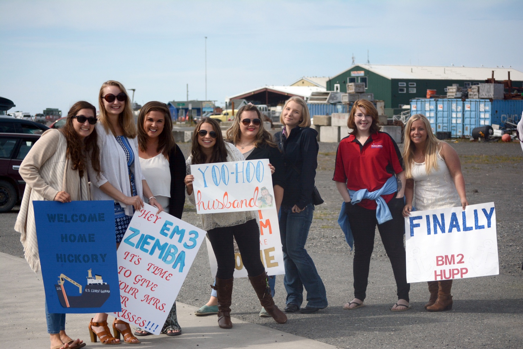 A group of U.S. Coast Guard wives wait at the Pioneer Dock on Thursday to greet their husbands after a four-month deployment on the U.S. Coast Guard Cutter Hickory. From left to right are Melissa Parker, Nicole Ziemba, Kaitlyn Burns, Emily Davis, Lyndsay McGarran, Carly Robinson, Madison Russell and Laura Hupp.-Photo by Michael Armstrong, Homer News