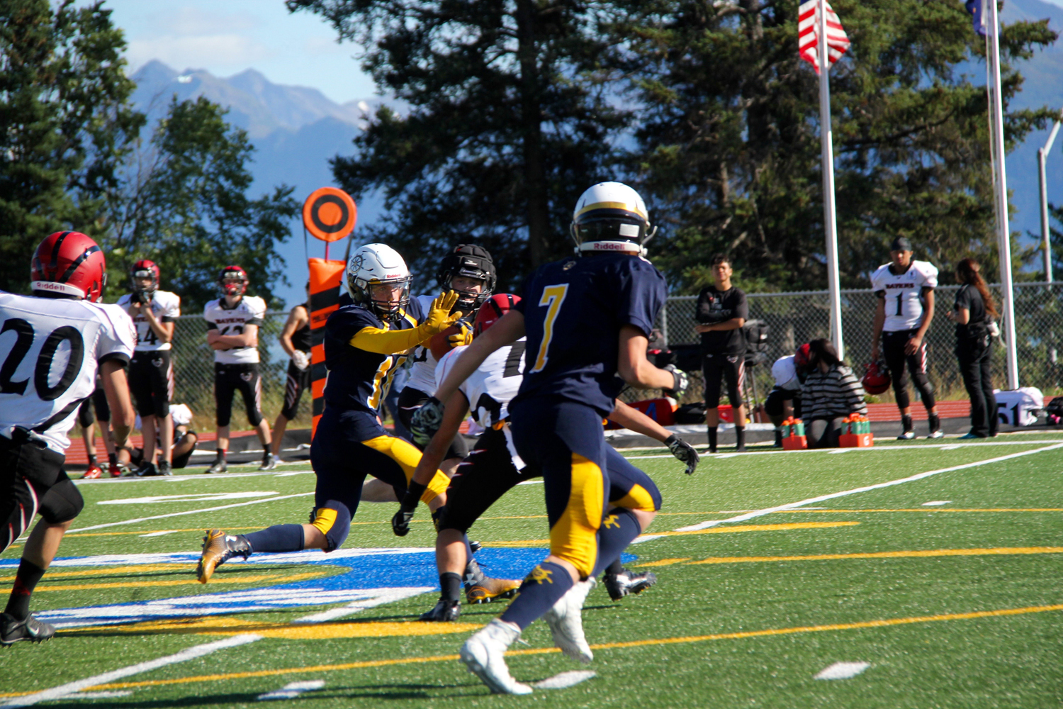 Mariner Justin Sumption uses his arm to block an Eielson Raven during Saturday’s game at Homer High School. -Photo by Annali Metz, Homer High School