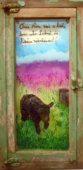 Tomich’s “Little Bear” is painted on a glass window.
