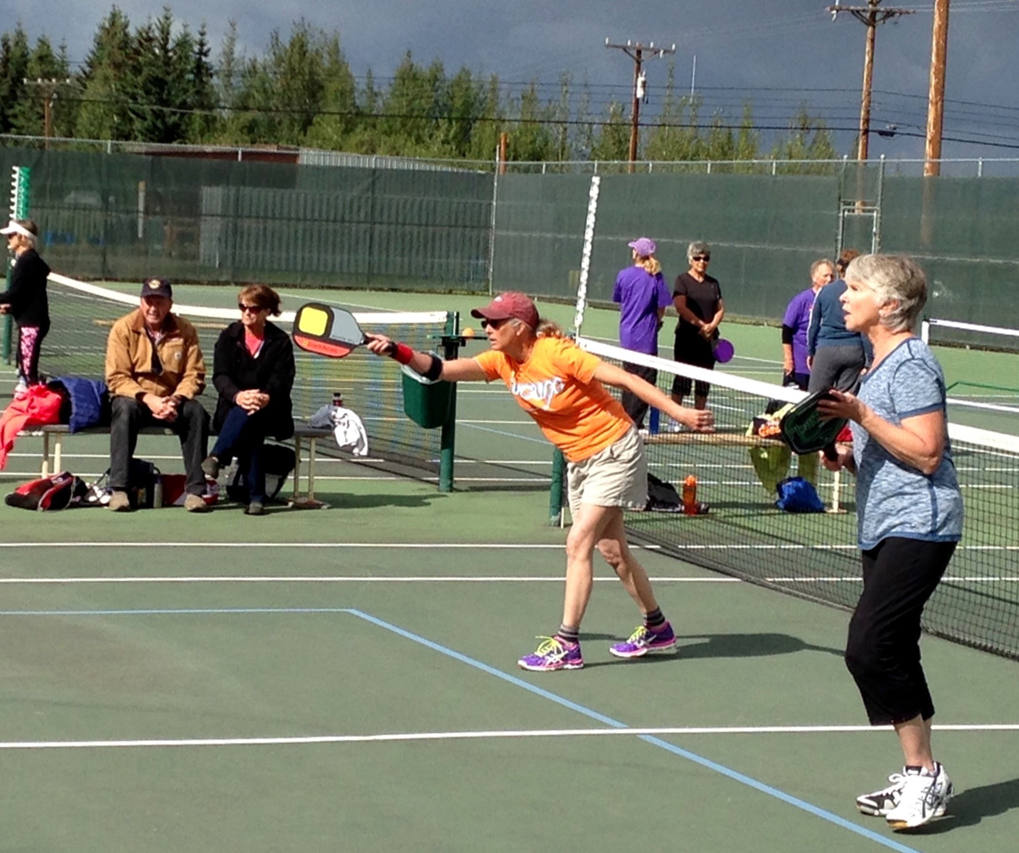 Holly Van Pelt, left, and Janie Leask, right, compete in the mixed doubles.-Photo provided