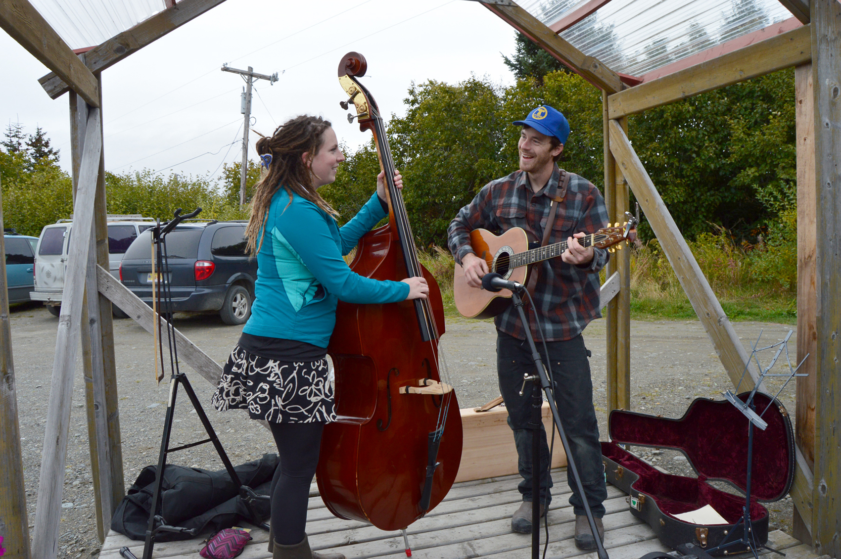 Above, Kari Odden and Kevin Duff perform for the crowd at the last official Homer Farmers Market of the season. -Photos by Annie Rosenthal
