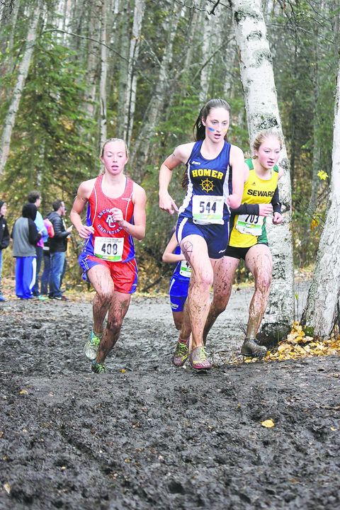 Homer junior Megan Pitzman (544) leads Anchorage Christian’s Elizabeth Balsan (408) and Seward’s Ruby Lindquist (703) in Saturday’s Class 123A girls state championship race at Bartlett High School in Anchorage. The Homer girls won their second straight cross-country team championship and the fifth in school history.-Photo by Joey Klecka, Morris News Service - Alaska