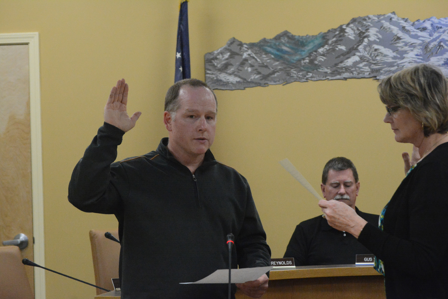 Homer City Council member Heath Smith takes the oath of office at a special meeting on Monday. Smith was elected in a run-off election on Nov. 3 when he defeated incumbent council member Beauregard Burgess. In final election results, Smith won with 401 votes, or 64 percent, to 227, or 36 percent, for Burgess. With 633 out of 4,520 registered voters, the election turnout was 14 percent. The council also selected council member David Lewis to be Mayor Pro-Tempore.-photo by Michael Armstrong, Homer News