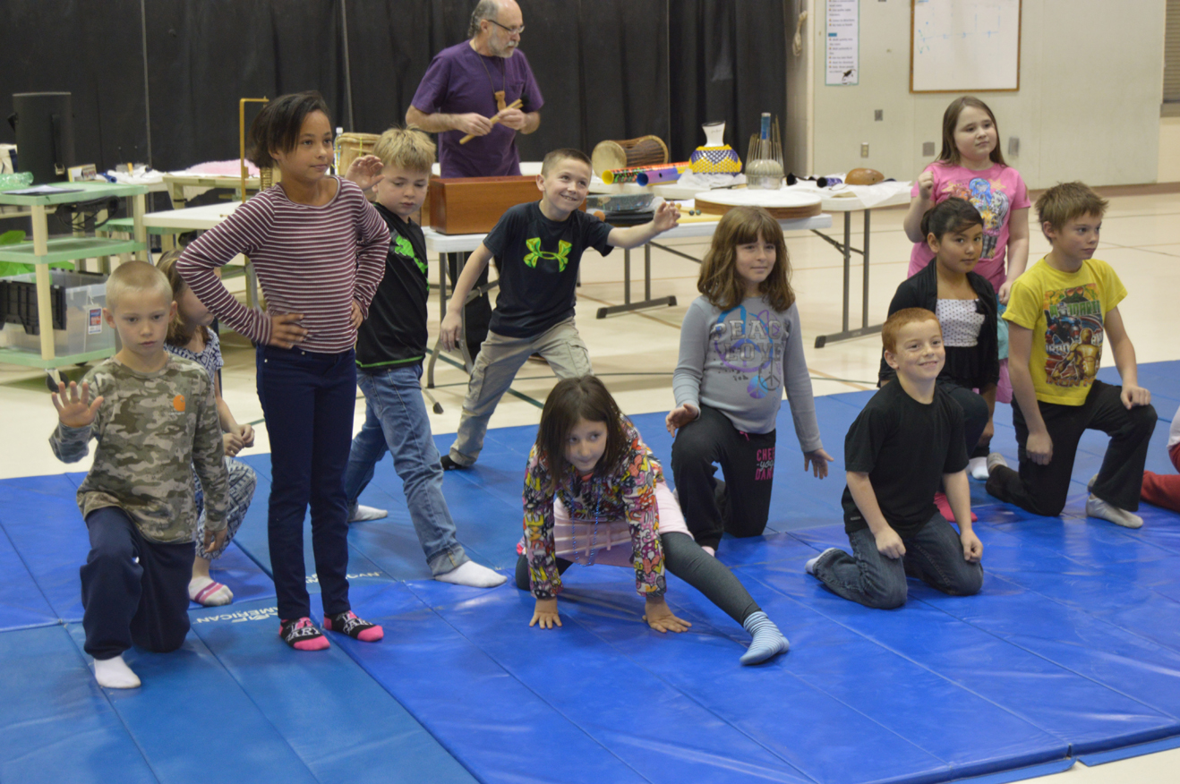Third grade students in Krista Etzwiler’s class at West Homer Elementary act out an interpretive dance to the sound of artist Eddie Wood’s storytelling and percussion. From left to right: Ethan Drake, Carolynn Sheldon, Preston Stanislaw, Kaleb Worland, Hailey VanSandt, Cecelia Gray, Josh Rudolph, Diamond Ojeda, Miriah Gassler and Aiden Clark.-photo by Annie Rosenthal