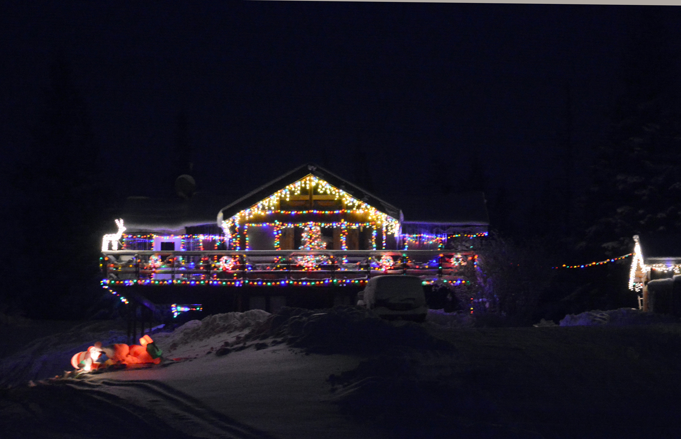 Lights and holiday figurines brighten up a home on Tuesday night near Mile 15 East End Road. -Photo by Michael Armstrong