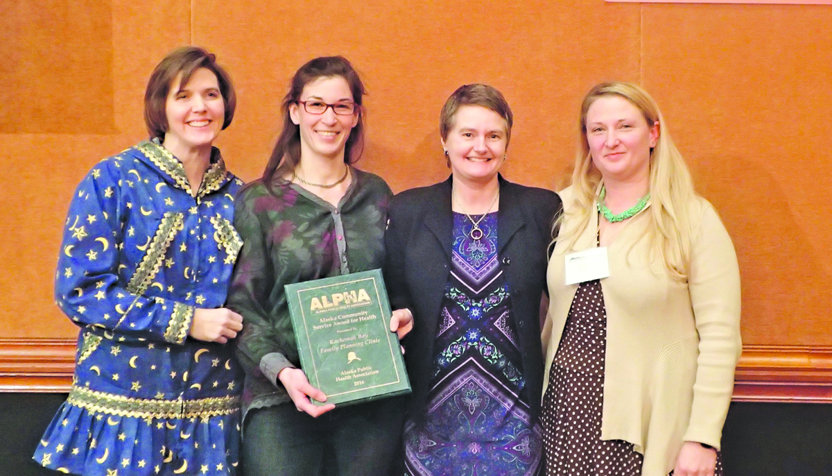Kachemak Bay Family Planning Clinic recently received the Alaska Community Service Award for Health from the Alaska Public Health Association. Posing with the award during the 33rd annual Health Summit in Anchorage are, from left, Lisa Aquino, former president of the Alaska Public Health Association; Anna Meredith, youth health education and programs manager for KBFPC; Catriona Reynolds, clinic manager;  and Jenny Baker, adolescent health project coordinator for the state’s Division of Public Health.