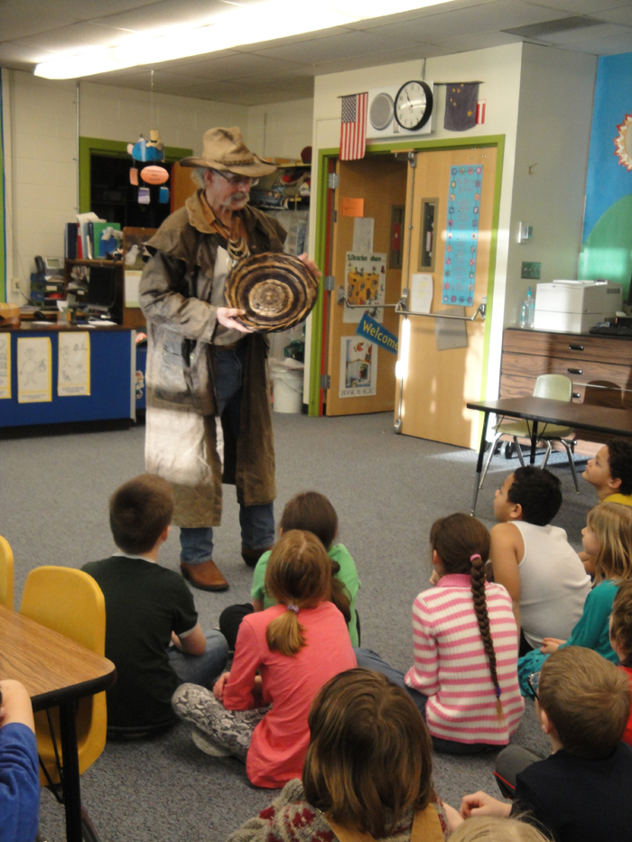 Reality TV Star and Kachemak Bay homesteader Atz Kilcher talks to students  at Paul Banks Elementary School during the 100-day school surprise.-Photo provided