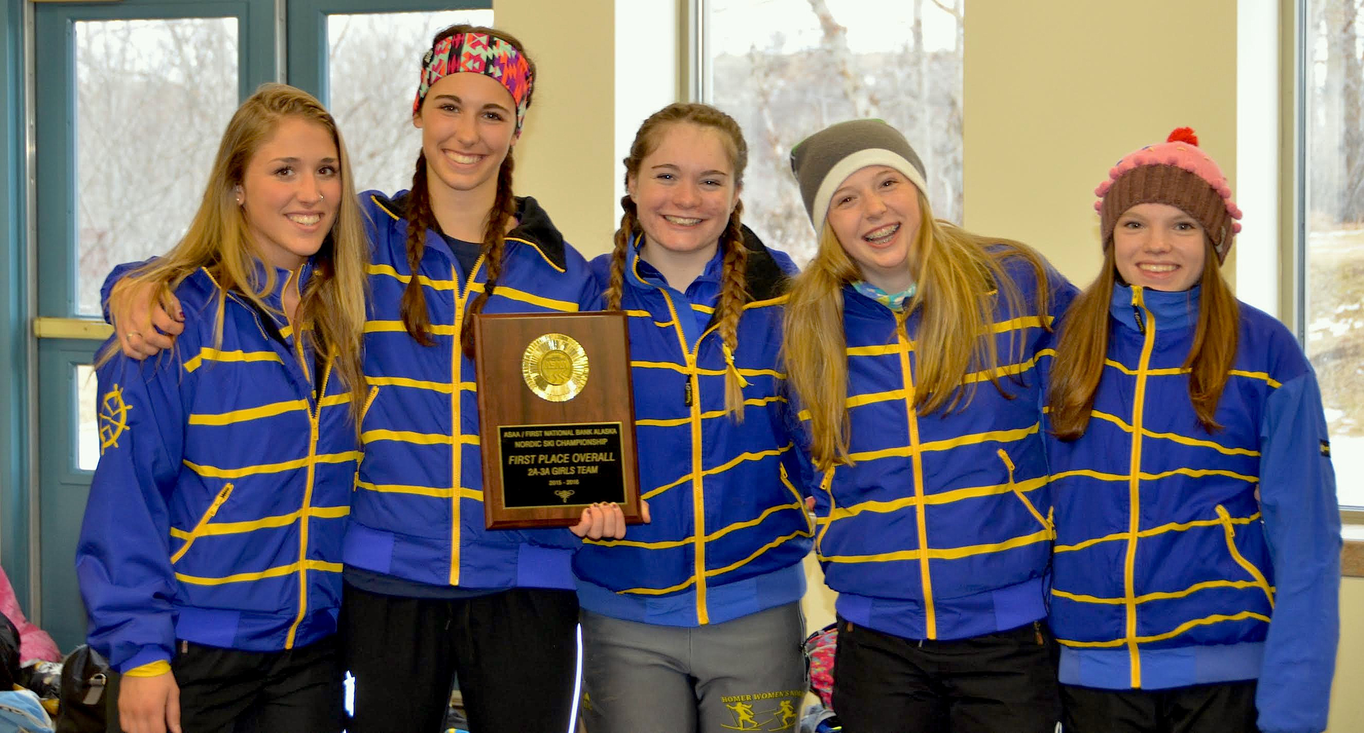 Rachel Ellert, Mariah Vantrease, Katia Holmes, Mia Alexson and Katie Davis show off their first place plaque. Homer High Schools girls took first place overall for 2A-3A teams at the Nordic ski state championship the weekend of Feb. 26.-Photo provided