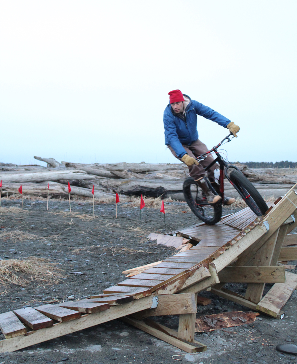 Forrest Janukajtis rounds a slanted ramp on the Big Fat Bike Festival obstacle course at the Friday, March 11 bonfire. Janukajtis come down from Anchorage to participate in the festival with his family.-Photo by Anna Frost, Homer News