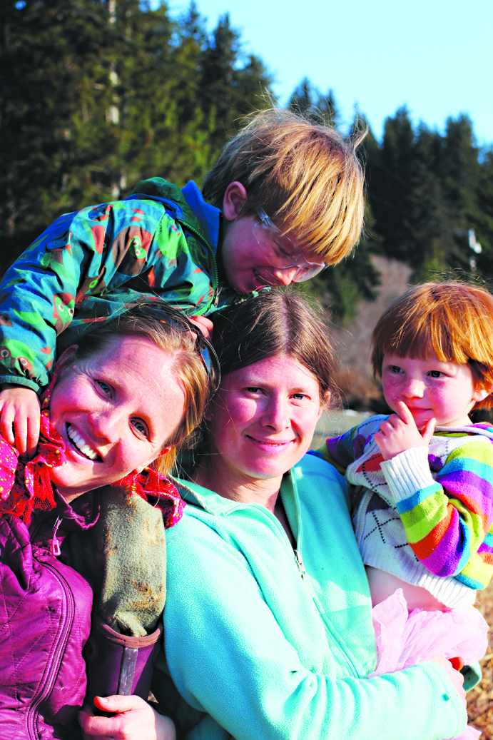 Valisa Higman, left, and Erin McKittrick, right, with McKittrick’s children, Katmai, left, amd Lituya, right. Katmai was the boy who inspired their book, “My Coyote Nose and Ptarmigan Toes.”-Photo povided