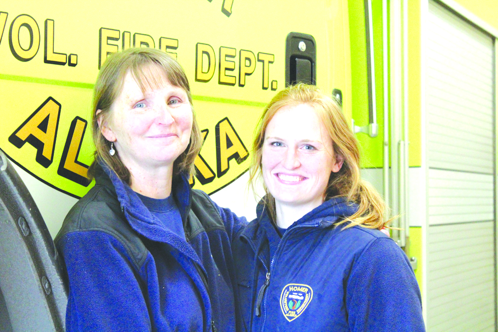 After 32 years with the Homer Volunteer Fire Department, Elaine Grabowski, left, marked her last day at Saturday’s annual Safe and Healthy Kids Fair. Taking over as departmental services coordinator is Jaclyn Arndt, right.-Photo by Anna Frost, Homer News