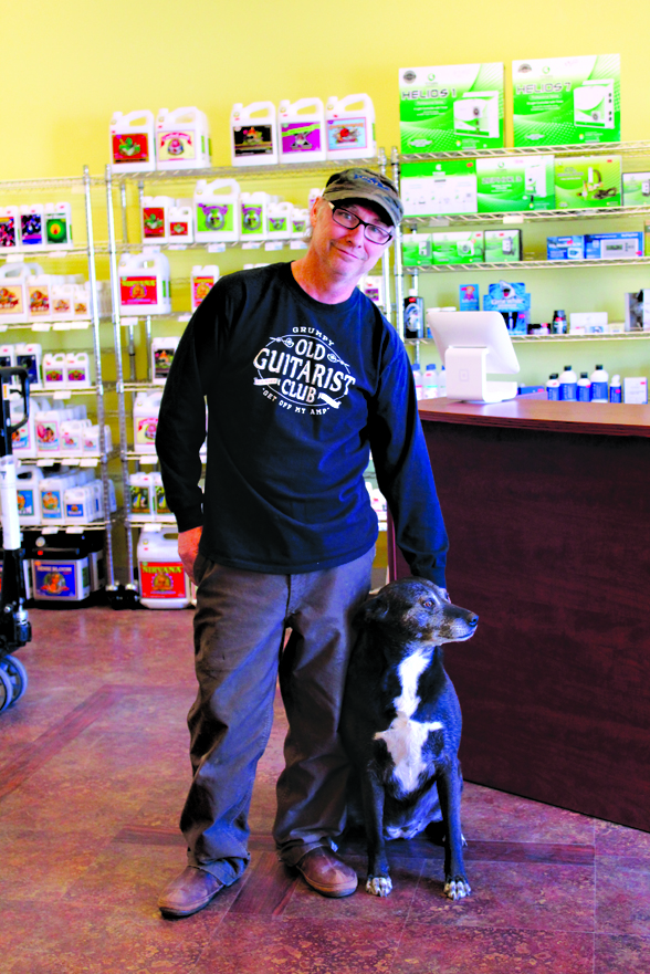 Panama Reds owner Carl Sanche and his shop dog Shae opened the Homer store in late May. Sanche also maintains his first store location in Kenai.-Photo by Anna Frost, Homer News