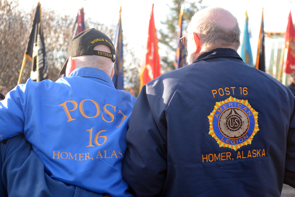 Veteran Craig Forrest, right, supports Louie Strutz, left, at Veterans Day ceremonies on Friday at the American Legion Veterans Memorial at the Alaska Islands and Ocean Visitor Center. Strutz served in World War II in the Aleutian campaign. Forrest served in the U.S. Army during the Vietnam War era.-Photo by Michael Armstrong, Homer News