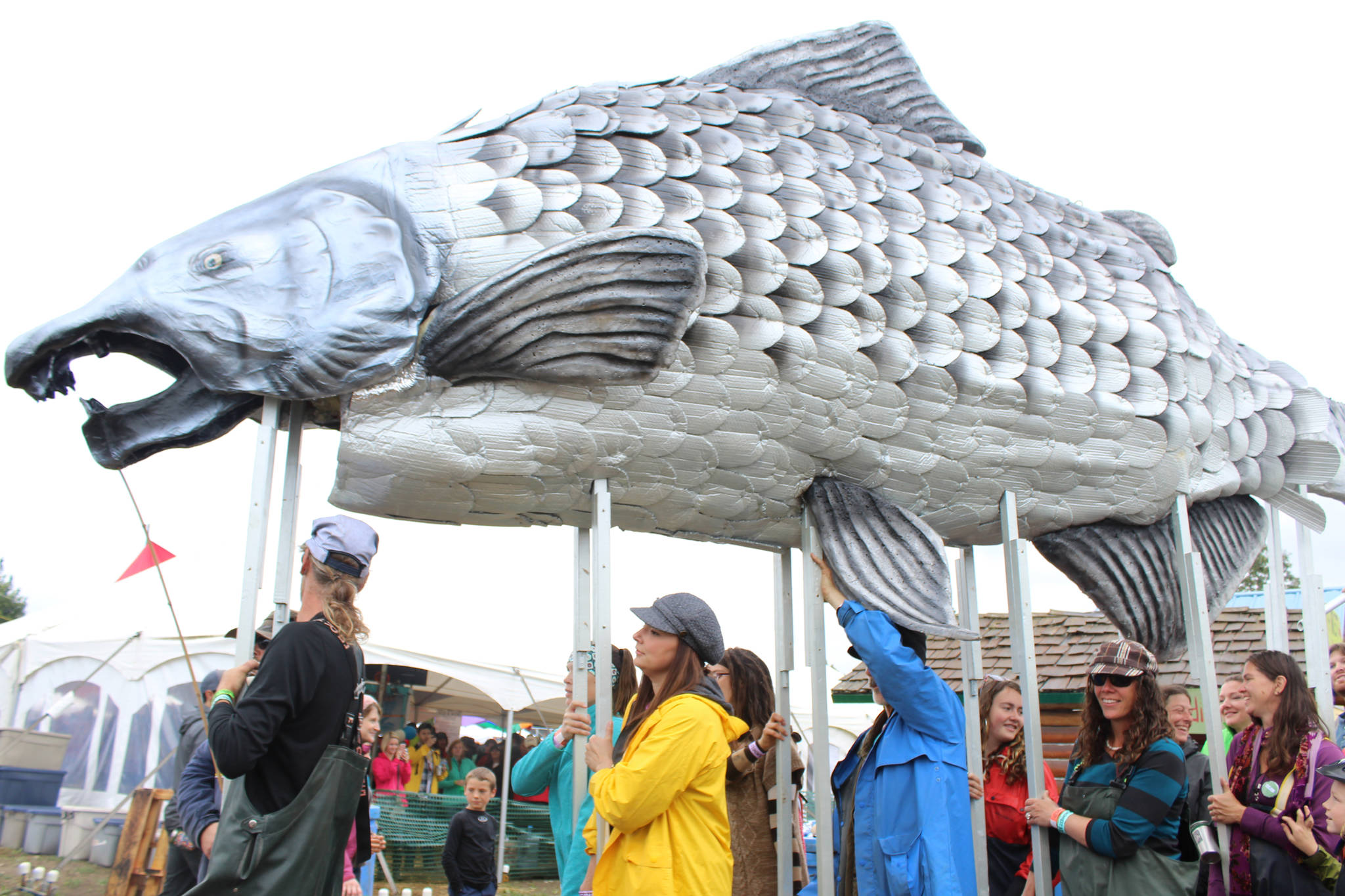 Participants in Salmonfest’s King Sam parade carried a giant salmon puppet throughout the festival grounds, followed by a procession of people celebrating the fish during the 2016 Salmonfest in Ninilchik, Alaska. (File photo by Anna Frost/Homer News)